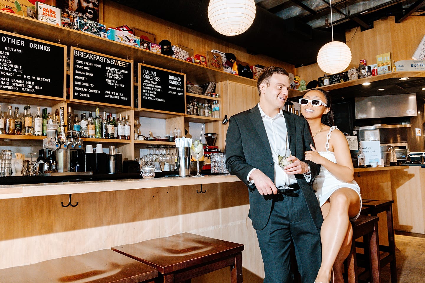 Jasmine and Aaron with cocktails at the Tonari bar during their Chinatown, Washington, DC engagement session